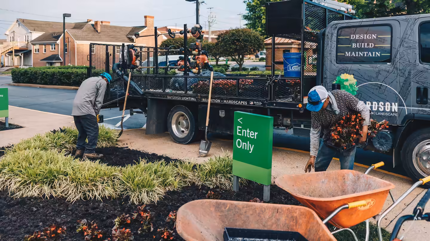 Richardson crew planting seasonal color beside the company truck in downtown Columbia