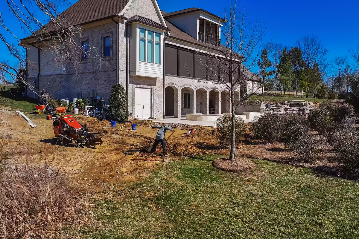 The back slope was bare clay. We trenched it before anything else went in.