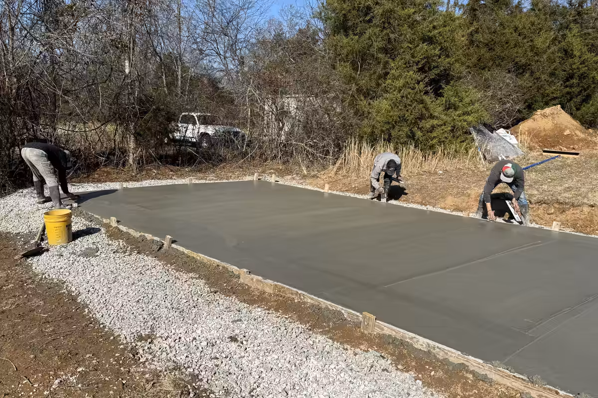 Fresh concrete pad on its gravel base