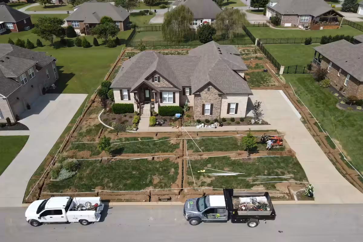 A whole yard with every irrigation zone trenched, seen from above