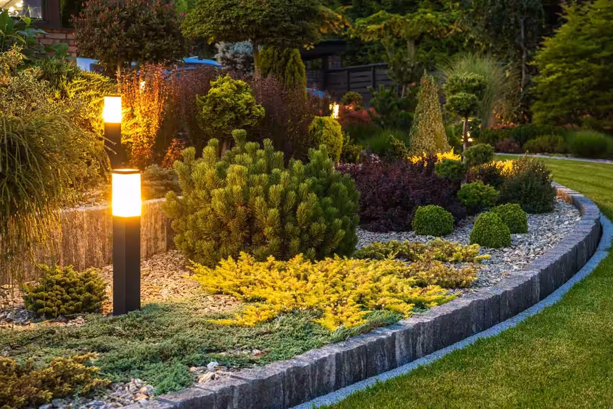 Path light glowing in a planted bed