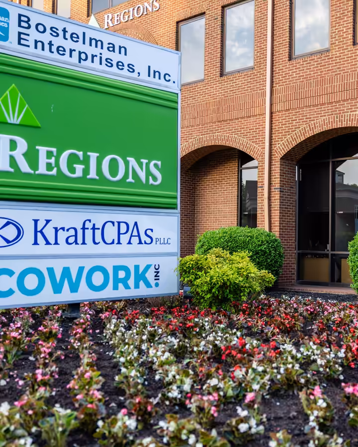 Seasonal begonia beds in front of the Regions and KraftCPAs sign in downtown Columbia