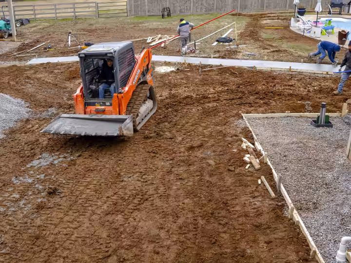 Richardson crew grading a new yard with a compact track loader
