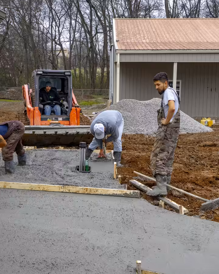 Richardson crew placing concrete for a garage pad