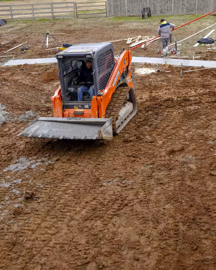 Richardson track loader grading a yard