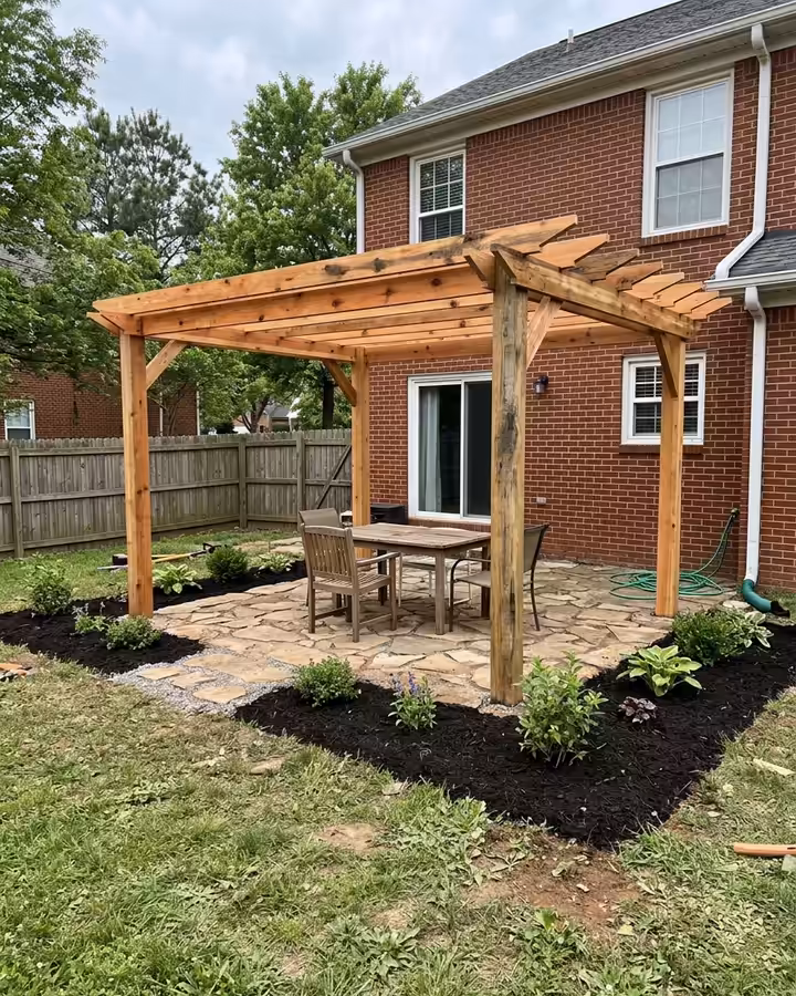 New cedar pergola over a backyard patio