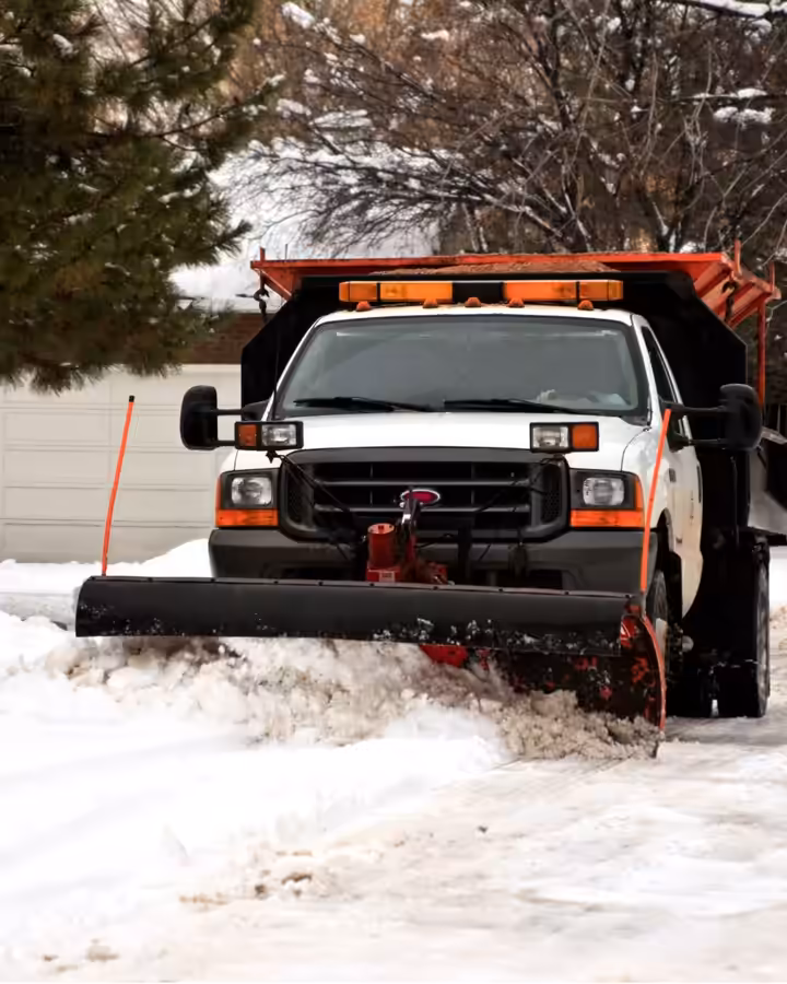 Richardson plow truck clearing a snowy drive